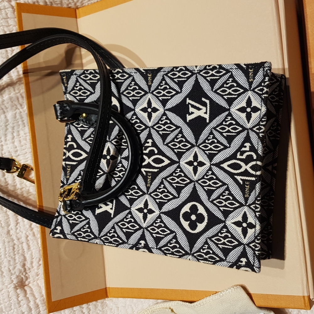 AUTHENTIC Louis Vuitton Since 1854 mini sac plat gris